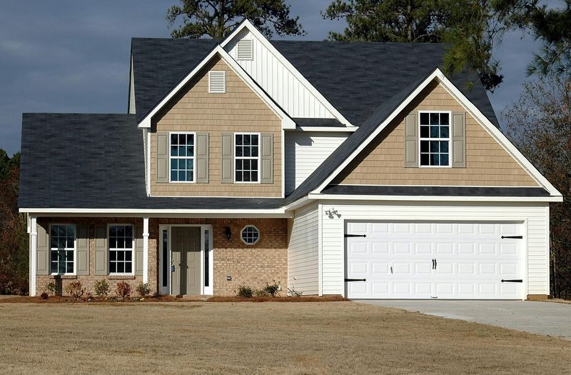 Before and after siding installation showing transformation of Durham home with new fiber cement siding