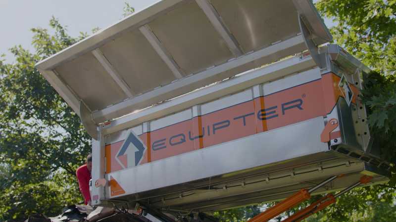 Roof Revivers uses the equipter, a mobile trash collector, to keep the job tidy.