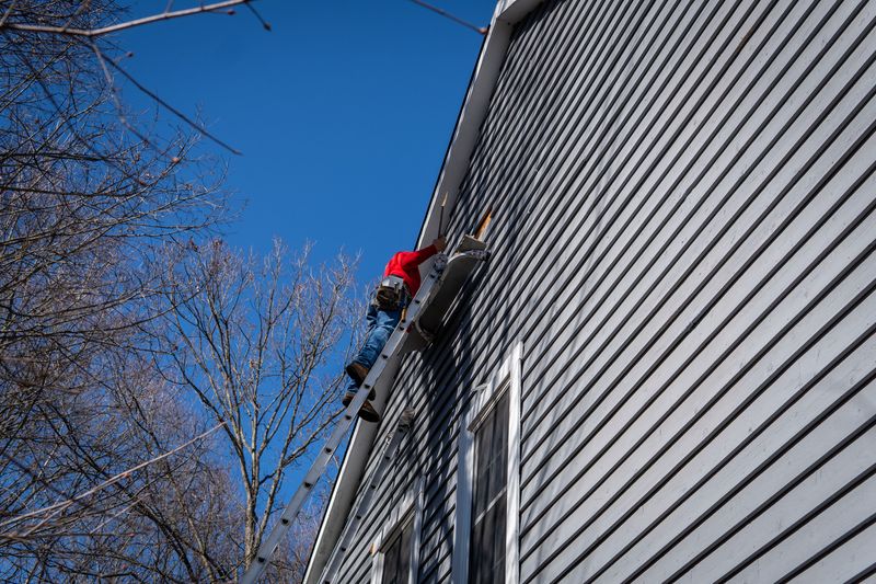 Roof Revivers installing siding on a nice Columbus, Ohio home.