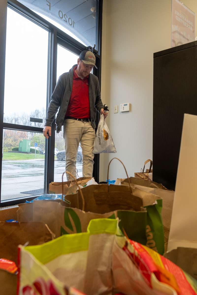 Joey, of Rood Revivers, sorting food drive donations.