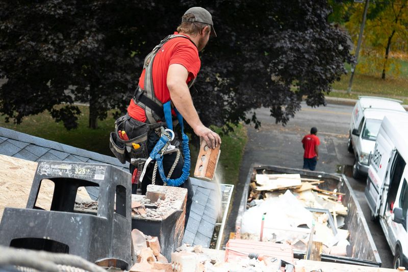 Professional roof repair crew responding to storm damage emergency at residential home in {location}, {state}.
