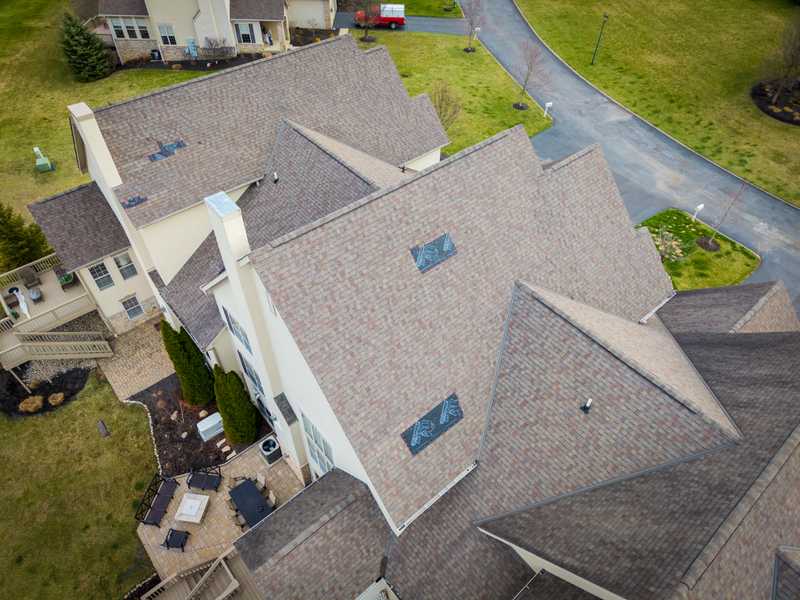 Roof Revivers tarps spots on a roof after severe weather and storm damage strikes.