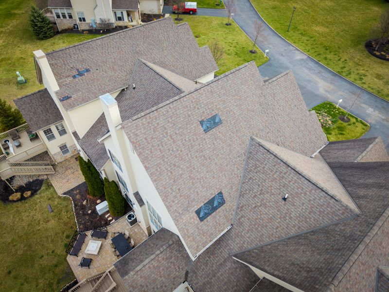 Roof Revivers tarps spots on a roof after severe weather and storm damage strikes.