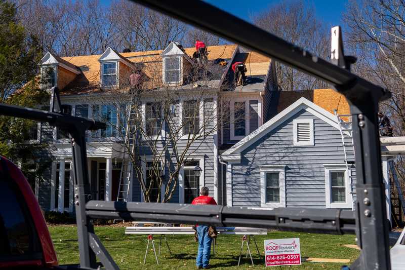 Roof Revivers performing a roof replacement and siding installation on a nice Columbus, Ohio home.