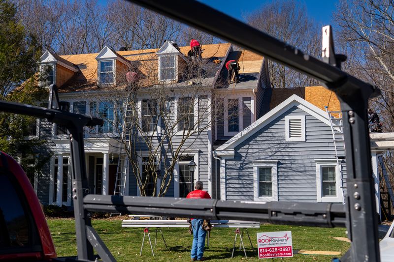 Roof Revivers performing a roof replacement and siding installation on a nice Columbus, Ohio home.