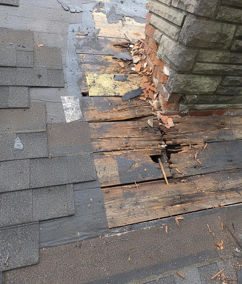 Rotted plank decking found beside the chimney when the roof was opened in Blacklick, Ohio