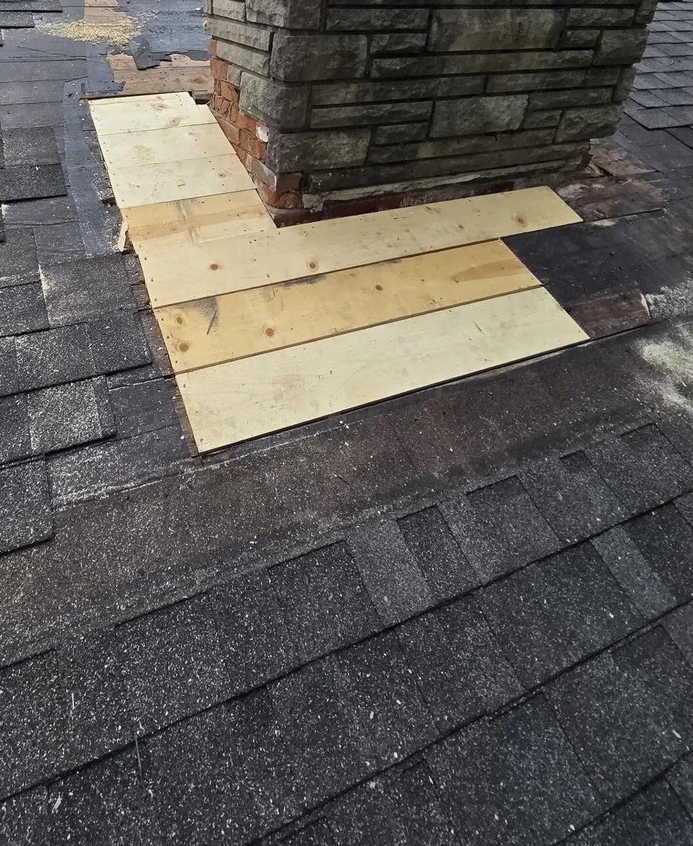 New decking boards installed around the chimney during the Blacklick, Ohio repair
