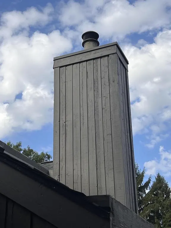 Wood-clad chimney chase on a Columbus, Ohio home, before repair