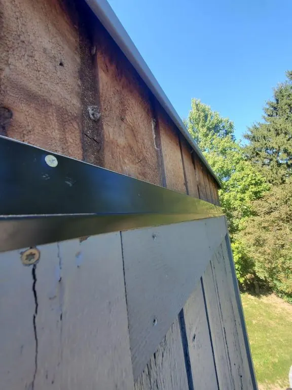 Weathered, cracked trim on a Columbus, Ohio chimney chase at inspection