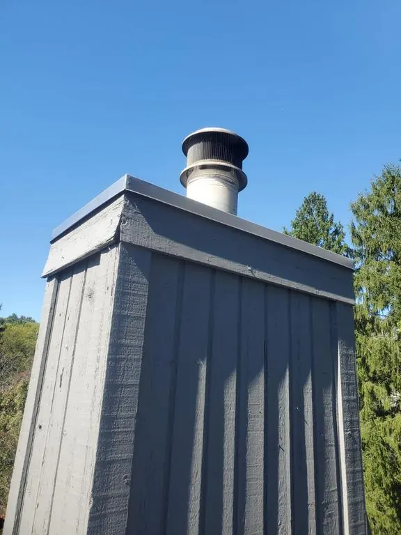 Chimney chase with new painted trim on a Columbus, Ohio home, after repair