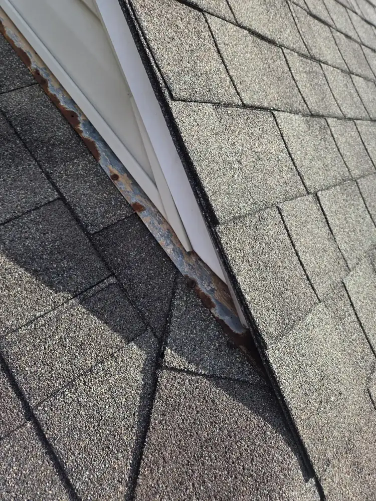 Shingles along a siding-to-roof wall line during a Columbus, Ohio flashing and shingle repair