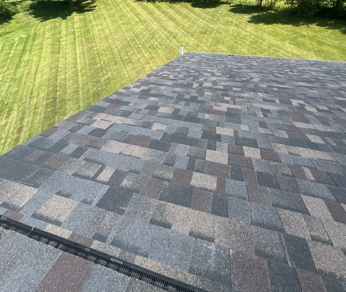 Finished Black Sable shingle field and ridge vent on a Delaware, Ohio roof, after roof replacement