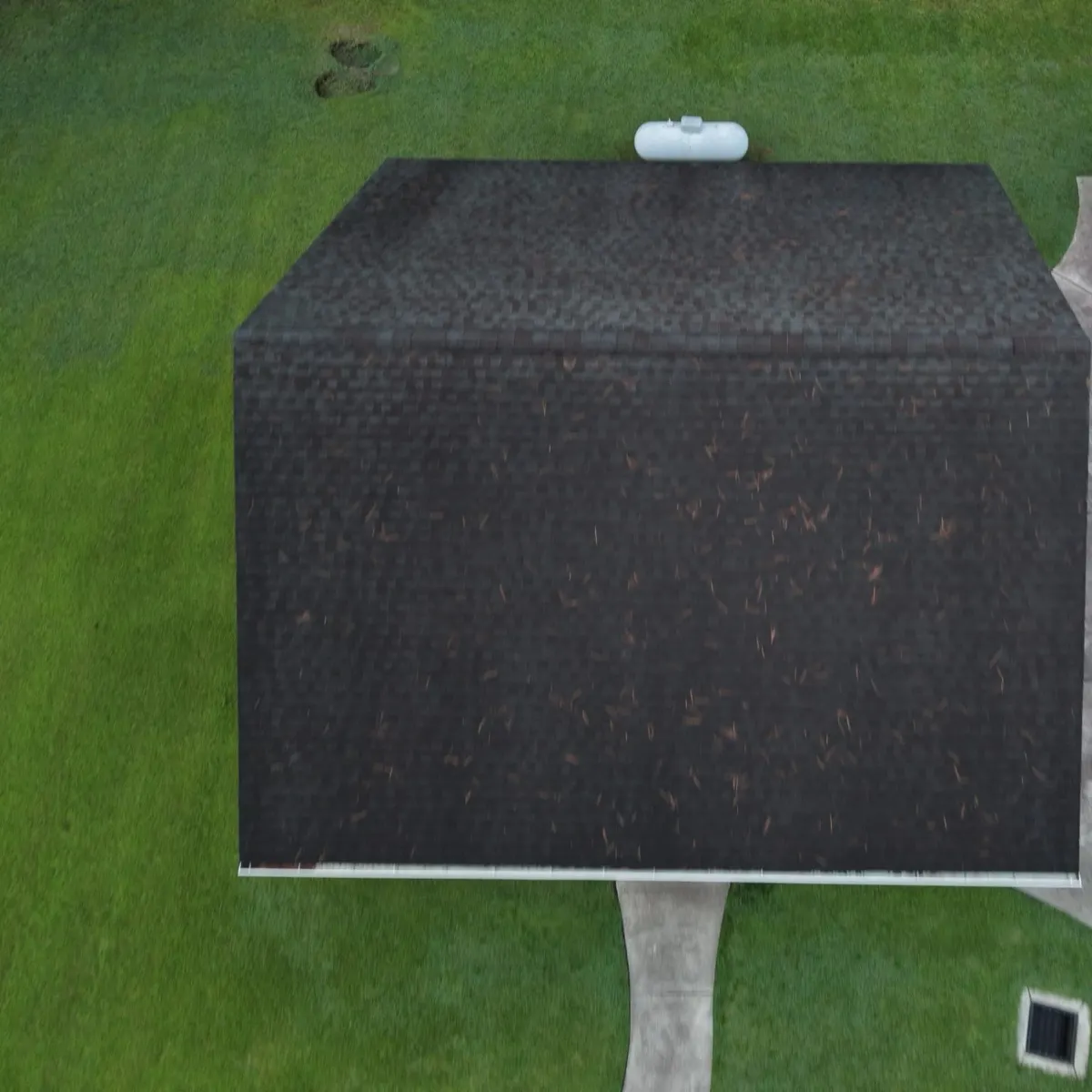 The same detached garage roof in Dunn, North Carolina, after replacement with new dark shingles