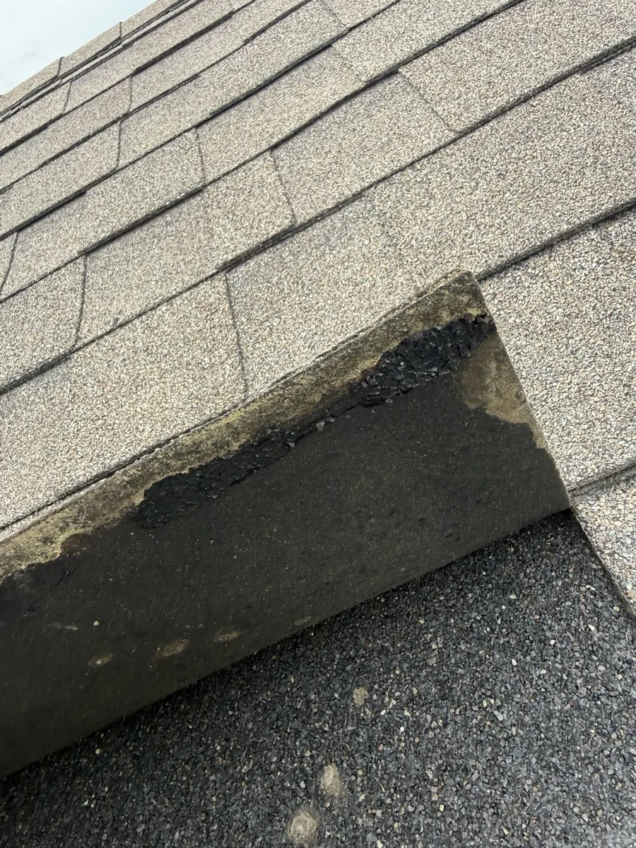 A shingle tab that has come unsealed from the roof in Dunn, North Carolina, before replacement