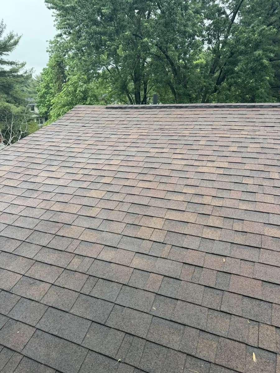 Worn asphalt shingles on the front slope of a Gahanna, Ohio home, before replacement