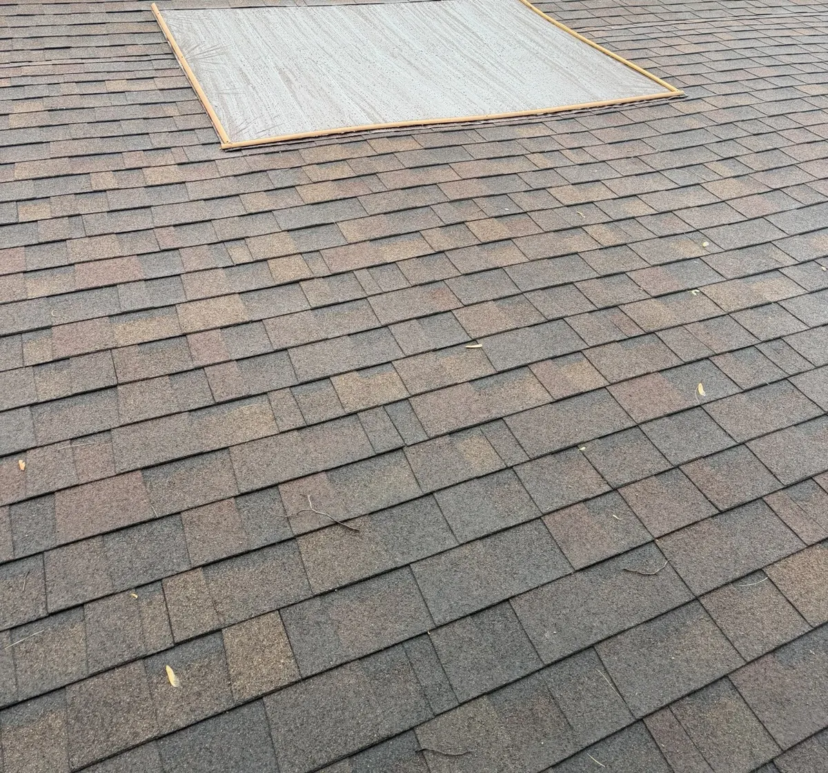 Old shingles around a roof opening on a Gahanna, Ohio home, before replacement