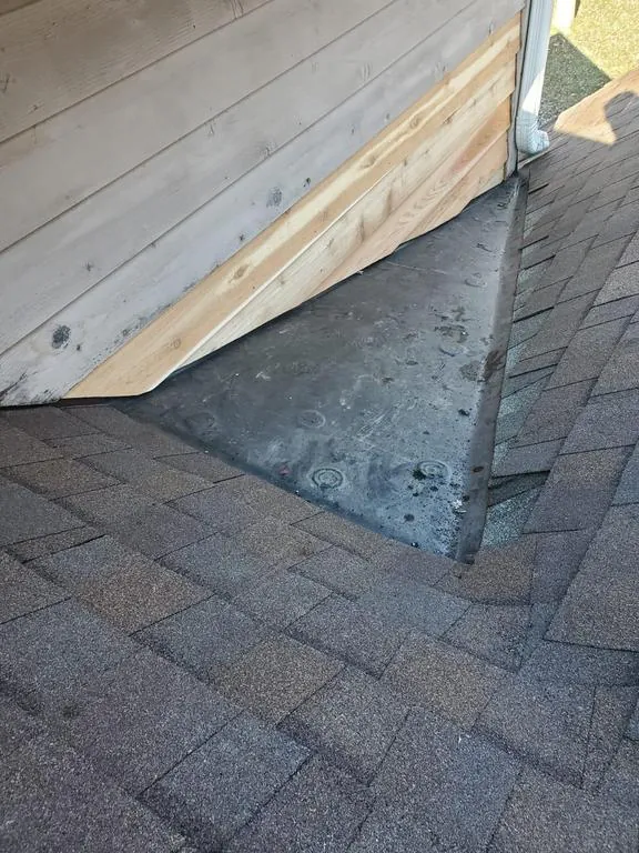 Rubber membrane and new shingles at the valley-to-wall junction in Galena, Ohio, after repair
