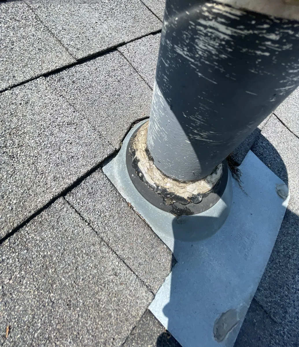 Cracked, worn rubber collar on a roof pipe boot on a Groveport, Ohio home, before repair