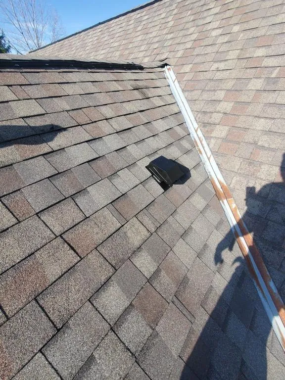Open metal valley on a Hilliard, Ohio roof at inspection, before repair