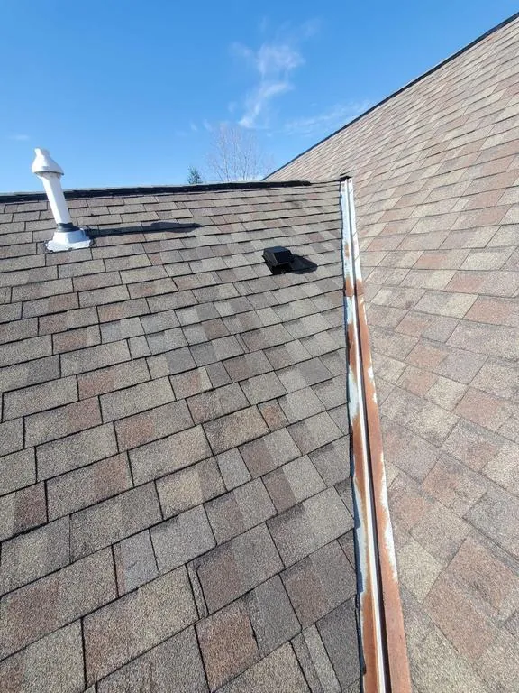 Finished valley area on a Hilliard, Ohio roof after decking and shingle repair