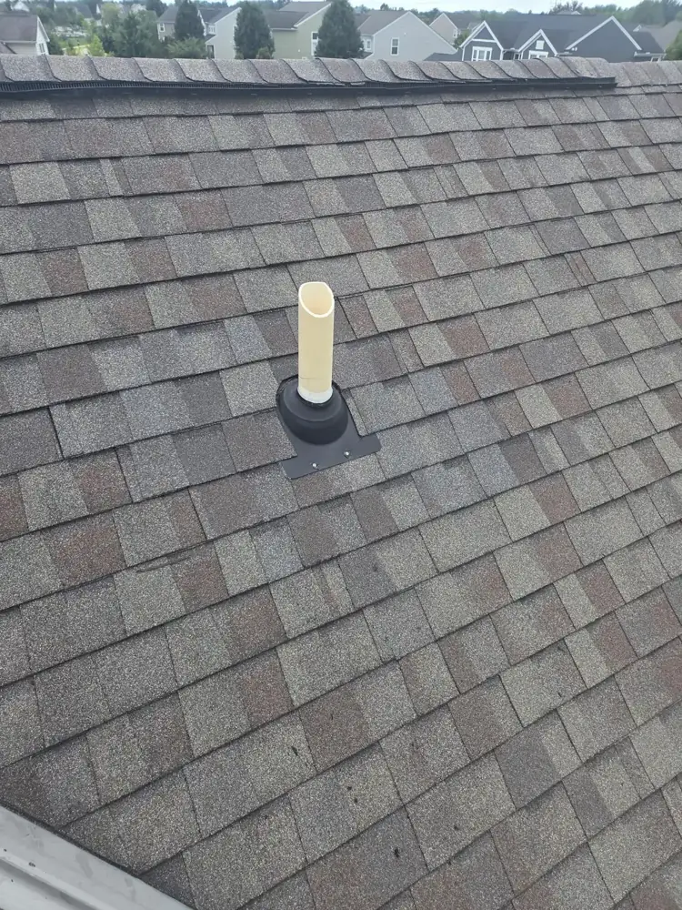 New pipe boot and shingles around a vent pipe in Hilliard, Ohio, after repair