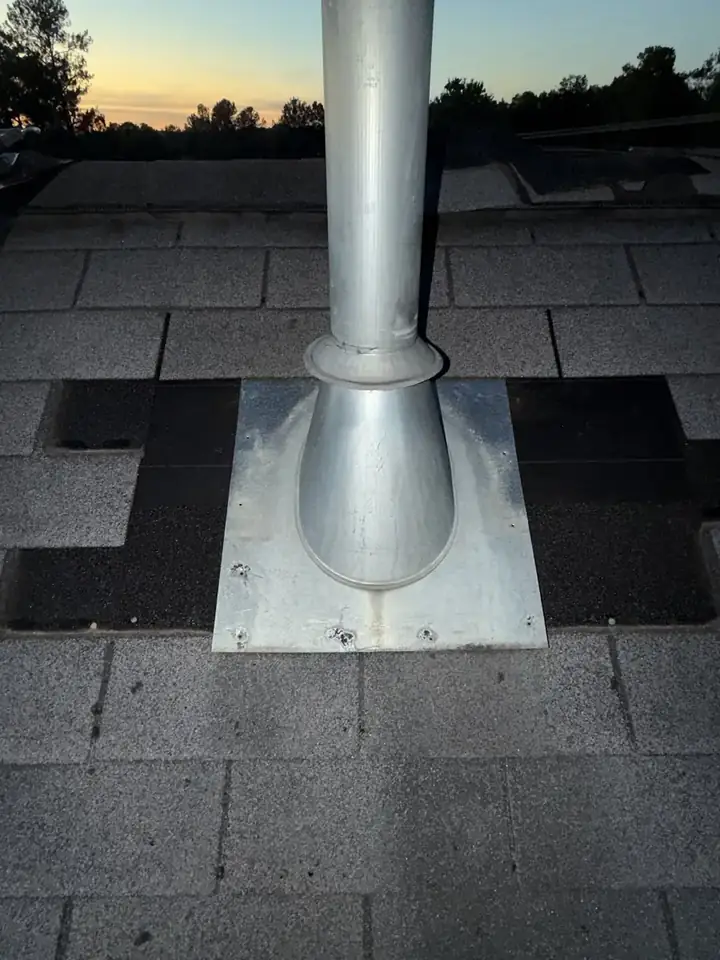 Finished vent pipe repair with new shingles around the flashing on a Holly Springs, North Carolina townhome roof, after the leak repair