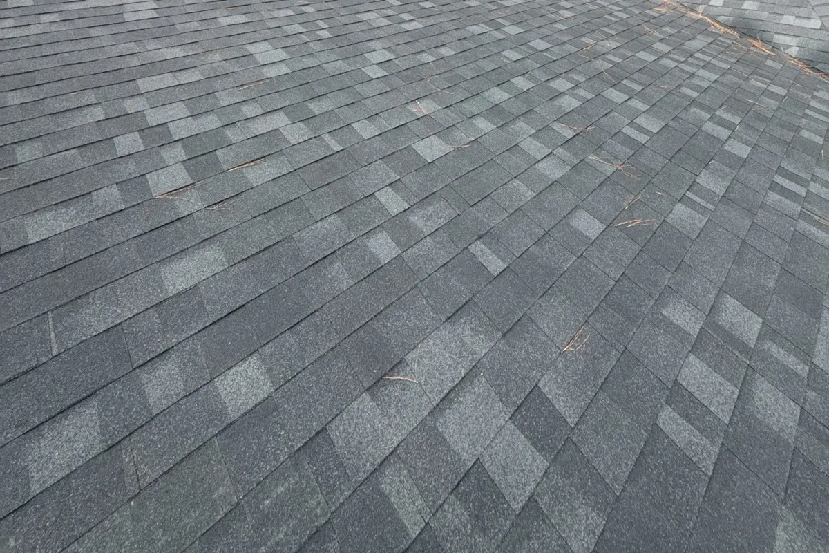 New gray Owens Corning Oakridge shingles on a Linden, North Carolina roof, after replacement