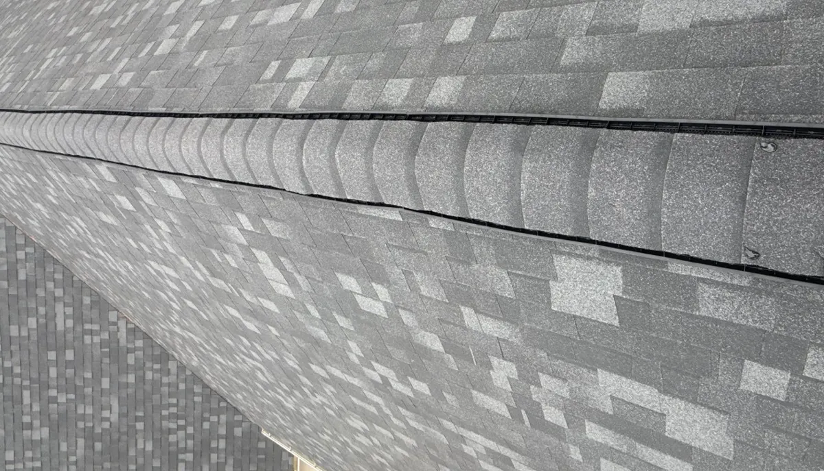 New ProEdge hip and ridge caps over a ridge vent on a Linden, North Carolina roof, after replacement