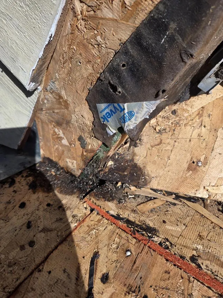 Roof opened at the wall, showing damaged decking, during a Powell, Ohio dead valley repair