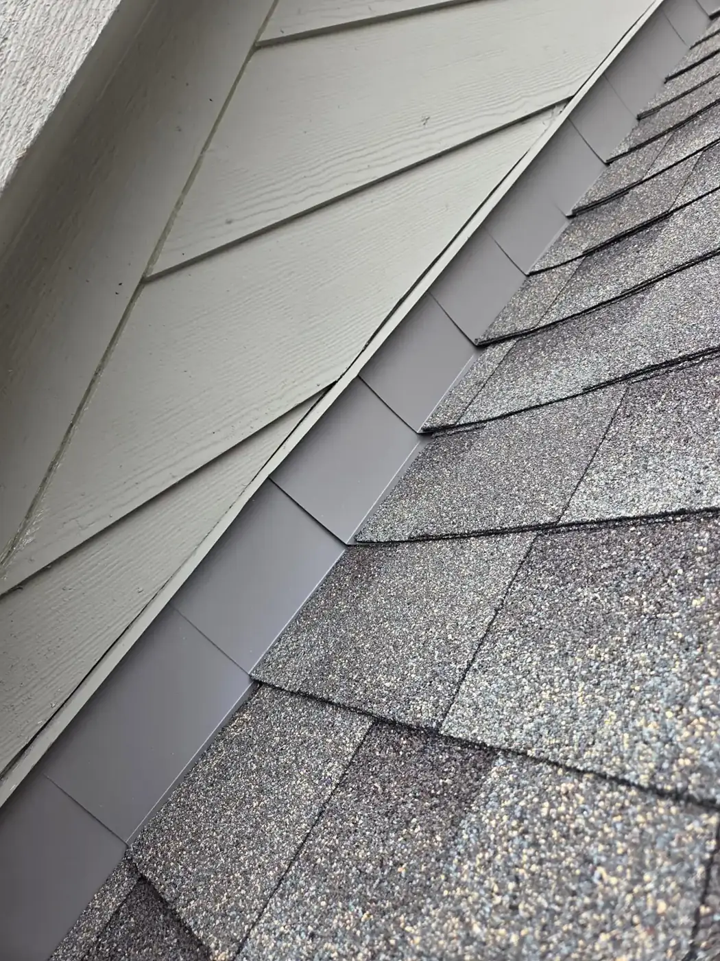 Finished shingles and flashing along the siding-to-roof wall in Powell, Ohio, after repair