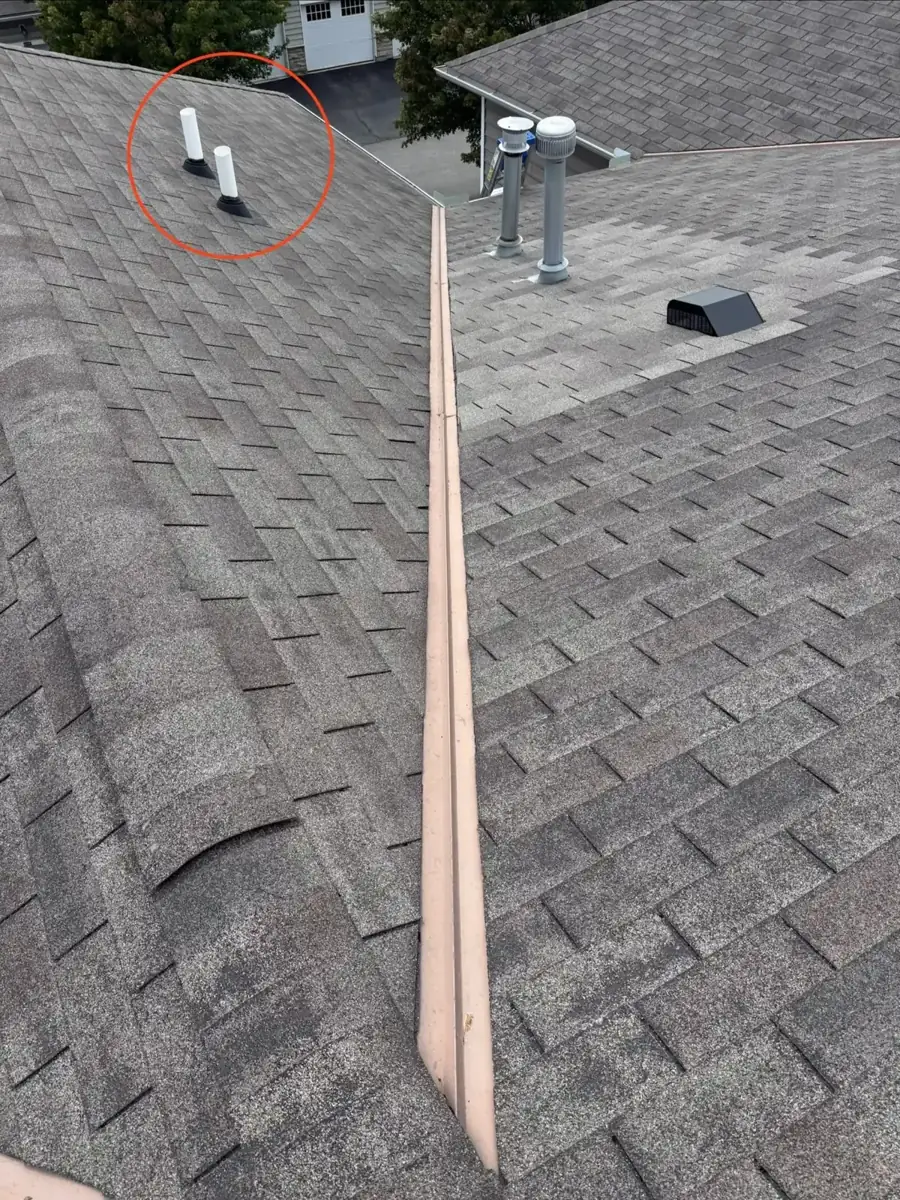 Two vent pipe boots on a Westerville, Ohio roof, before replacement