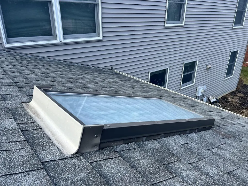 Old skylight with worn flashing on a Westerville, Ohio roof, before replacement
