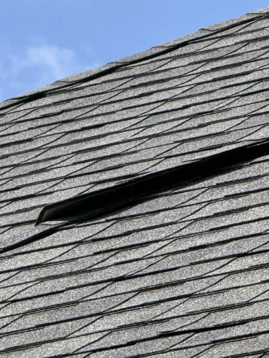 Lifted shingle on a Worthington, Ohio roof at inspection