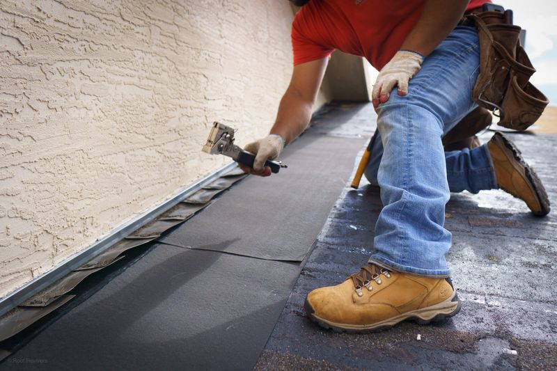Roof-to-wall flashing detail during a roof repair